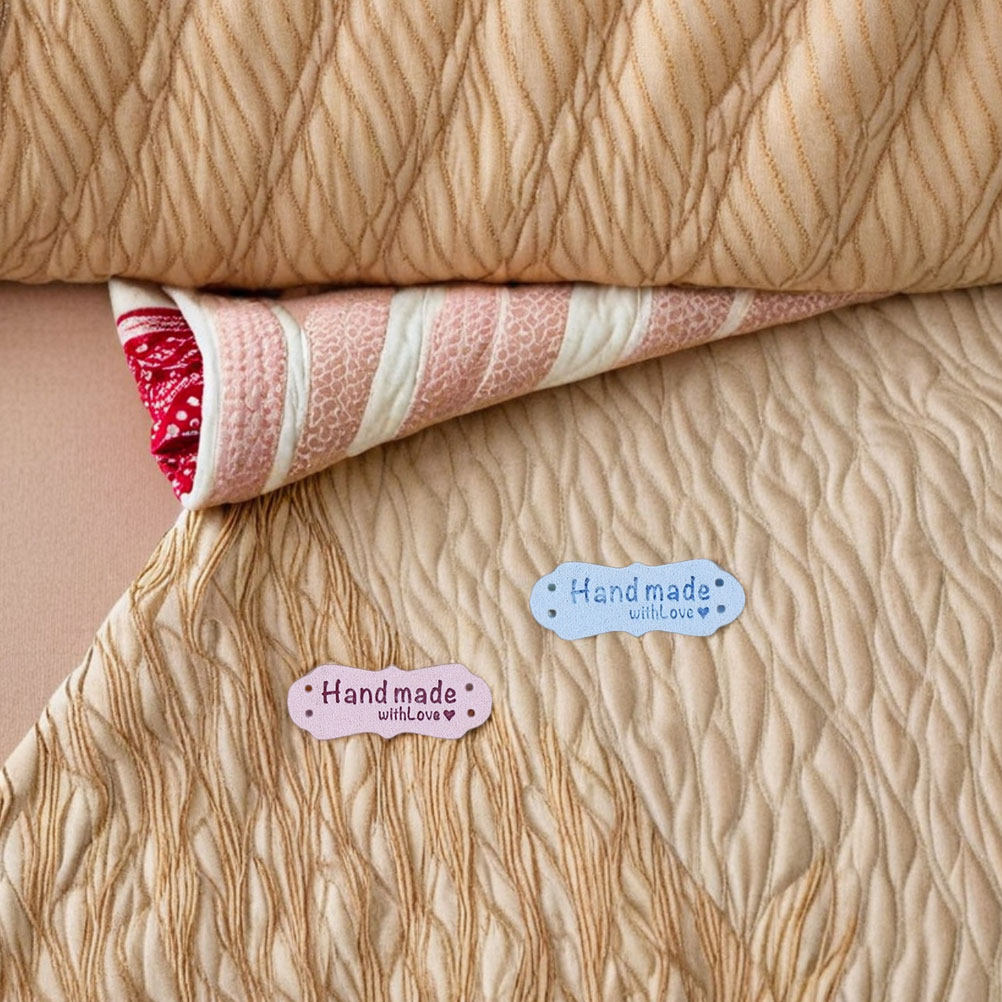 100Pcs Handmade Embossed Suede - огляд і ціна Sewing Label